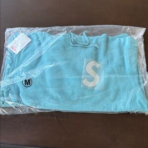 SUPREME Swarovski S Logo Hooded Sweatshirt Light Aqua, size Med. UNOPENED.